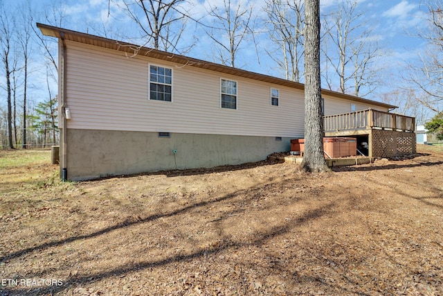back of property featuring a wooden deck and central air condition unit