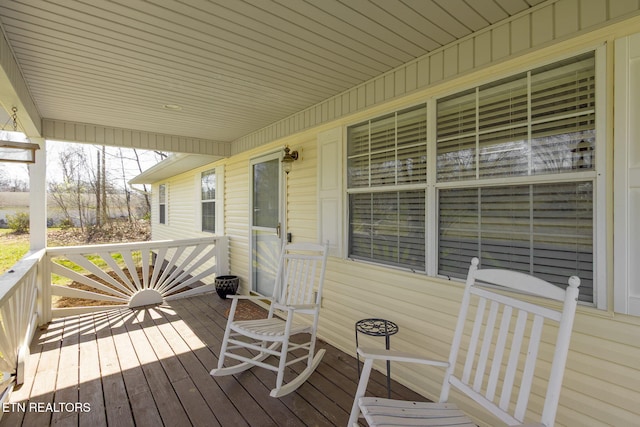 wooden terrace featuring a porch