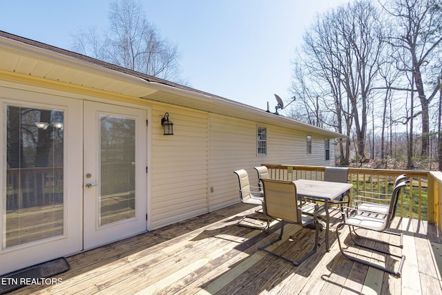 deck featuring outdoor dining area