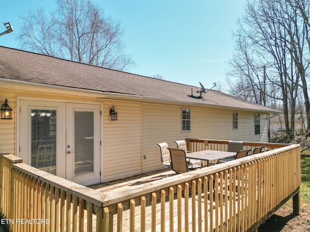 deck featuring outdoor dining area