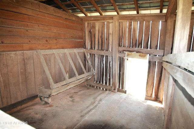 interior space featuring wood walls