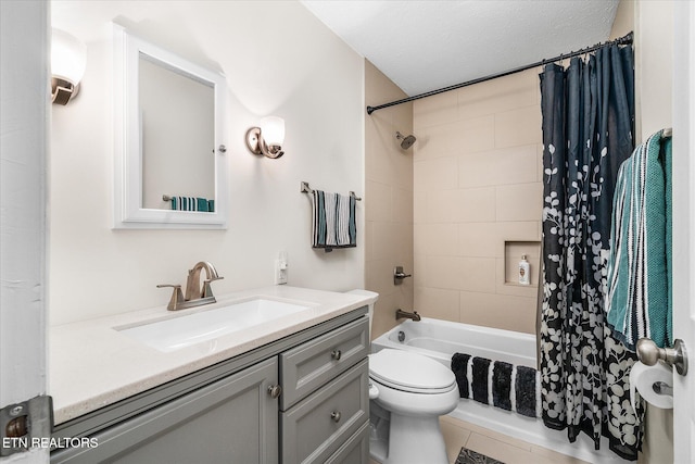 full bathroom with toilet, a textured ceiling, vanity, and shower / bath combo