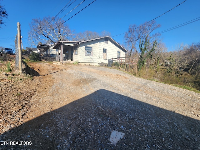 exterior space featuring dirt driveway