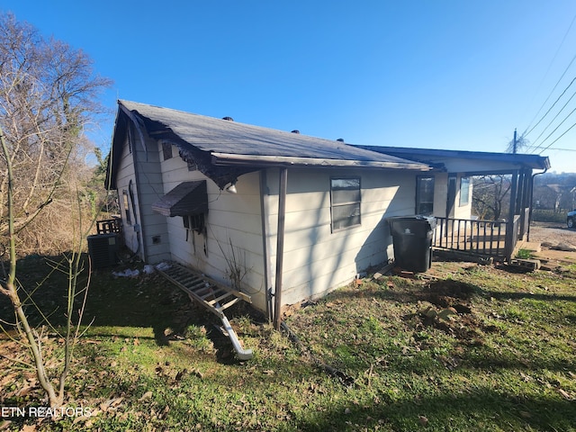 view of property exterior with central AC