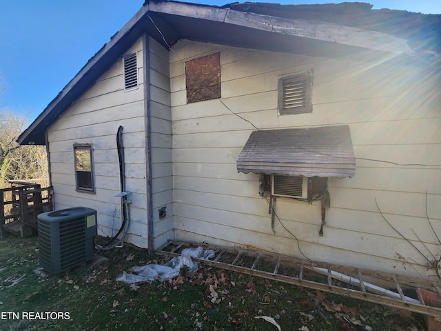 view of home's exterior featuring cooling unit and central AC unit