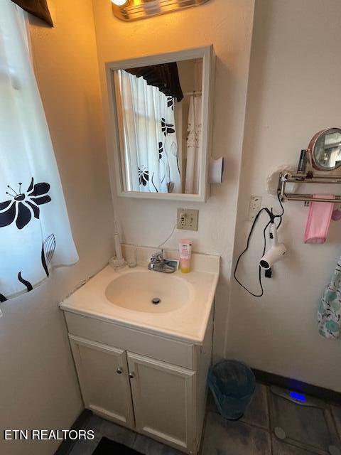 bathroom featuring tile patterned floors and vanity