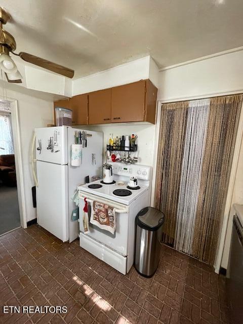 kitchen with brick patterned floor, white appliances, and a ceiling fan