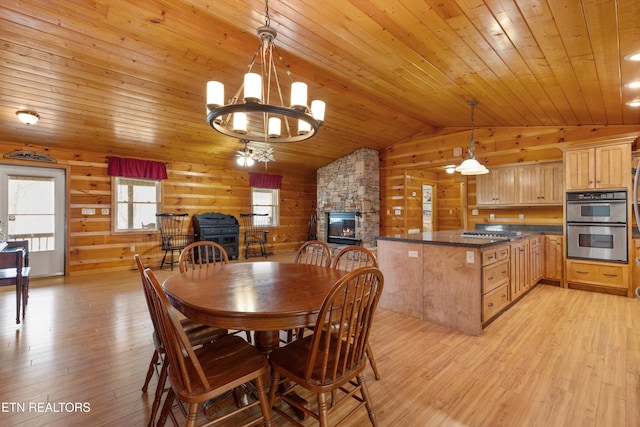 dining room with an inviting chandelier, vaulted ceiling, light wood-style flooring, and wood ceiling