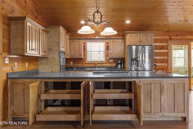 kitchen featuring wall oven, decorative light fixtures, wood ceiling, stainless steel fridge, and a sink