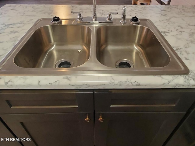 room details featuring light countertops and a sink