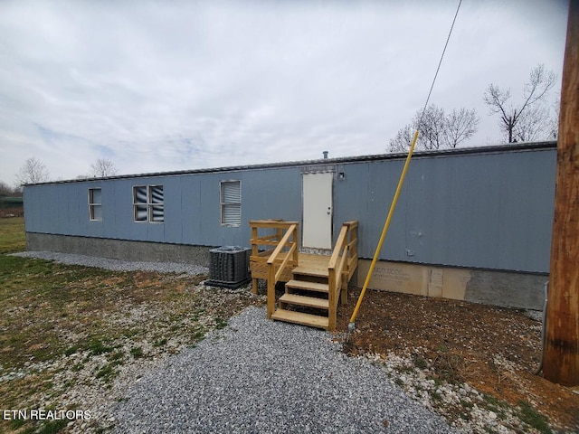 exterior space with crawl space and central AC unit