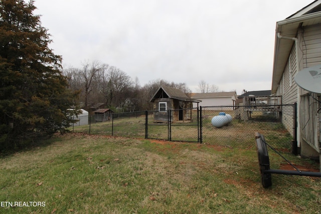 view of yard with a gate and fence