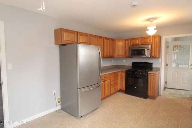 kitchen with stainless steel appliances, baseboards, light floors, and light countertops