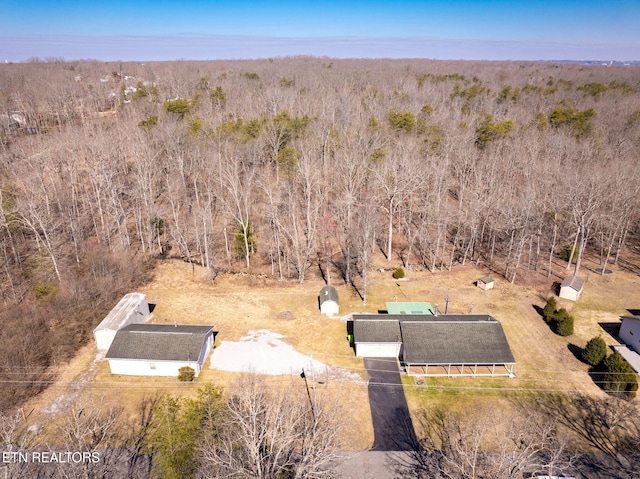 aerial view with a wooded view