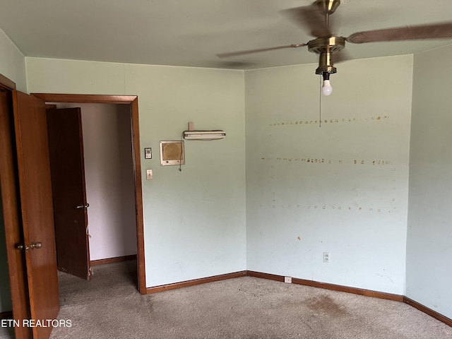 unfurnished room with baseboards, carpet floors, and ceiling fan