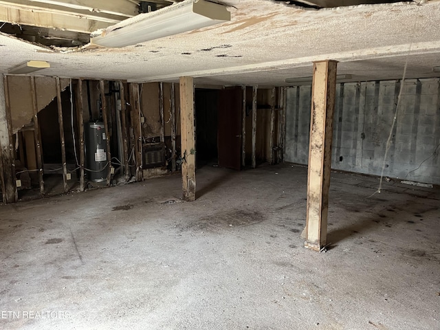 unfinished basement with water heater