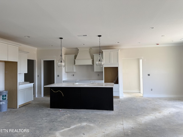 kitchen featuring premium range hood, a center island, white cabinetry, concrete floors, and baseboards