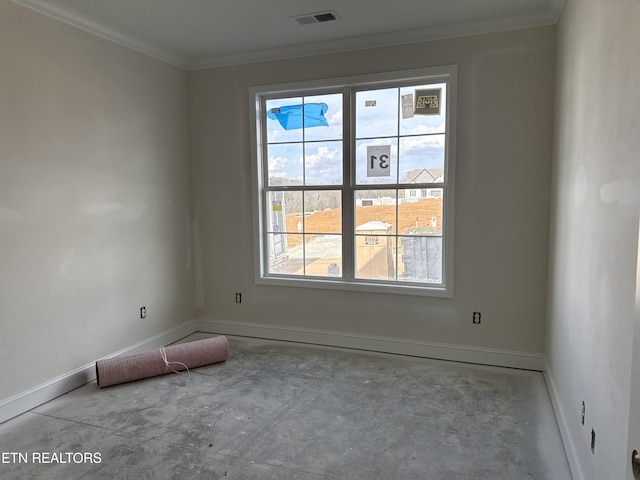 spare room with visible vents, crown molding, concrete flooring, and baseboards