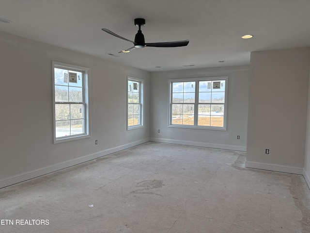 empty room with baseboards and a ceiling fan