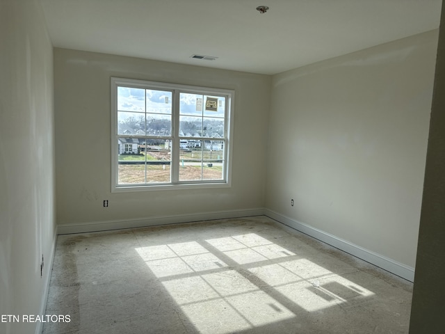 unfurnished room featuring visible vents and baseboards