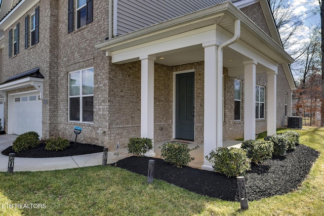 doorway to property with cooling unit and brick siding