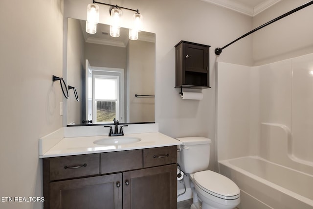 bathroom with shower / washtub combination, toilet, vanity, and ornamental molding