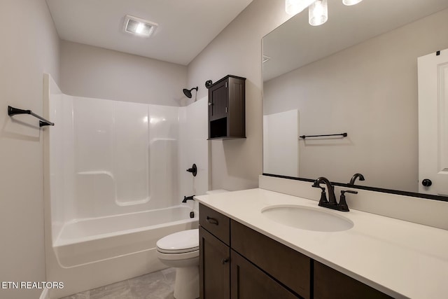 bathroom with vanity, toilet, visible vents, and shower / bathtub combination