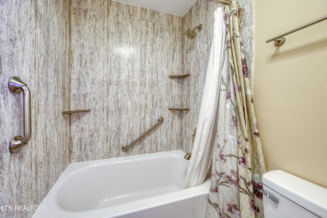 bathroom with shower / bath combination with curtain and toilet