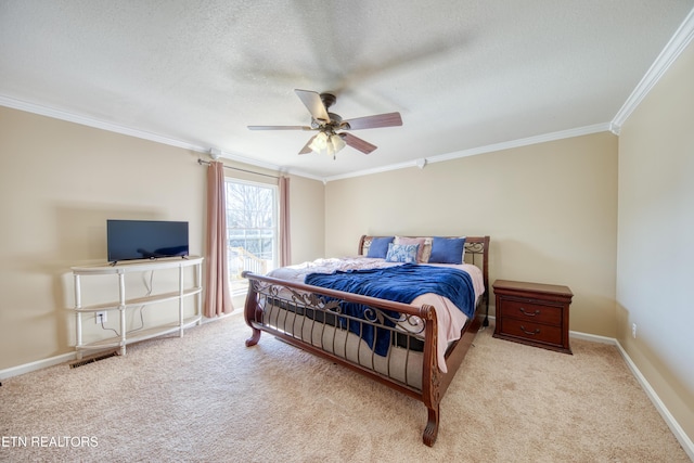 bedroom with crown molding, baseboards, carpet floors, and a textured ceiling