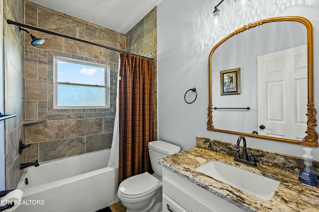 bathroom with vanity, toilet, and shower / tub combo