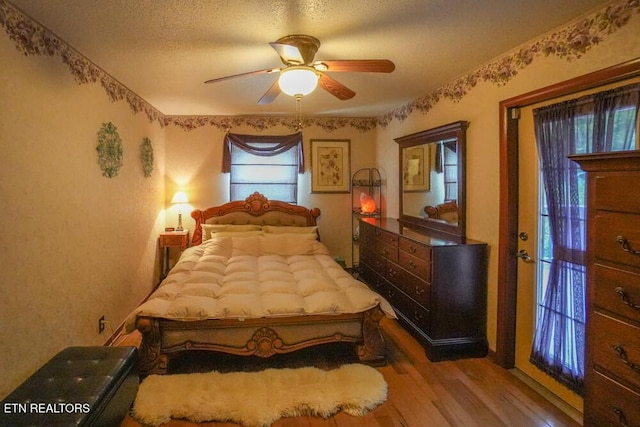 1301 Chert Pit Rd, Knoxville, TN 37923 - bedroom featuring wood finished floors, ceiling fan, and a textured ceiling