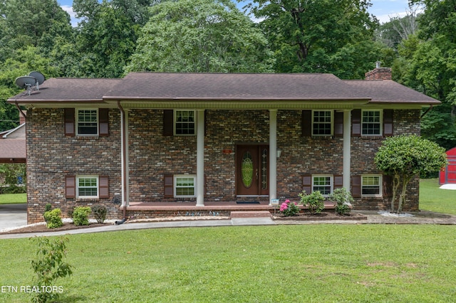 1301 Chert Pit Rd, Knoxville, TN 37923 - bi-level home with covered porch, a chimney, a front lawn, and roof with shingles