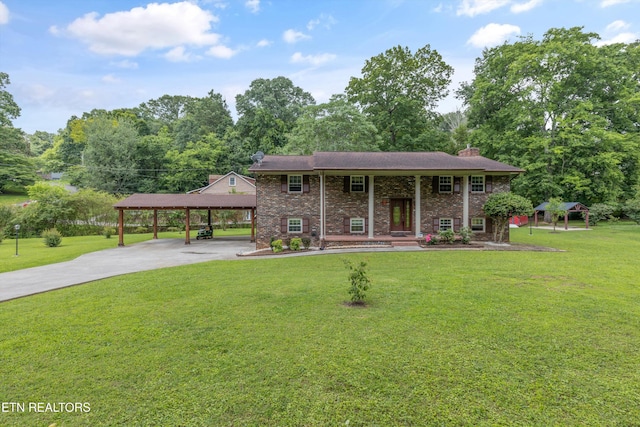 1301 Chert Pit Rd, Knoxville, TN 37923 - split foyer home with concrete driveway, a chimney, a front yard, and a carport