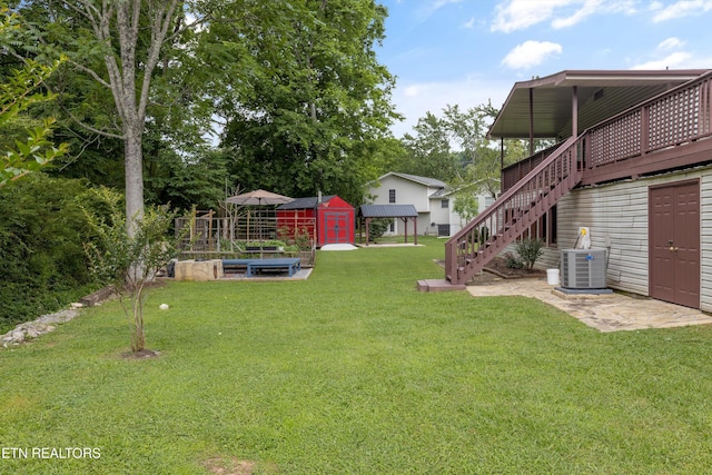 1301 Chert Pit Rd, Knoxville, TN 37923 - view of grassy yard with a storage shed, stairs, a garden, and a wooden deck