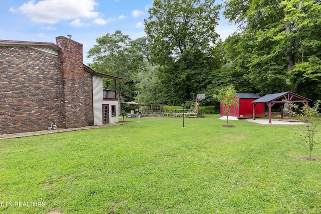 1301 Chert Pit Rd, Knoxville, TN 37923 - view of green lawn featuring a patio, a gazebo, and a storage shed