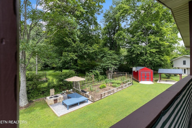 1301 Chert Pit Rd, Knoxville, TN 37923 - view of green lawn featuring a storage unit, a garden, and view of scattered trees