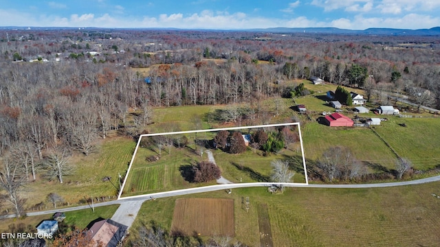 birds eye view of property featuring a rural view