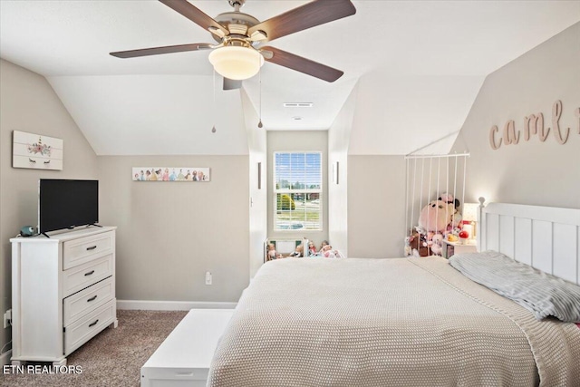 carpeted bedroom featuring visible vents, baseboards, ceiling fan, and vaulted ceiling