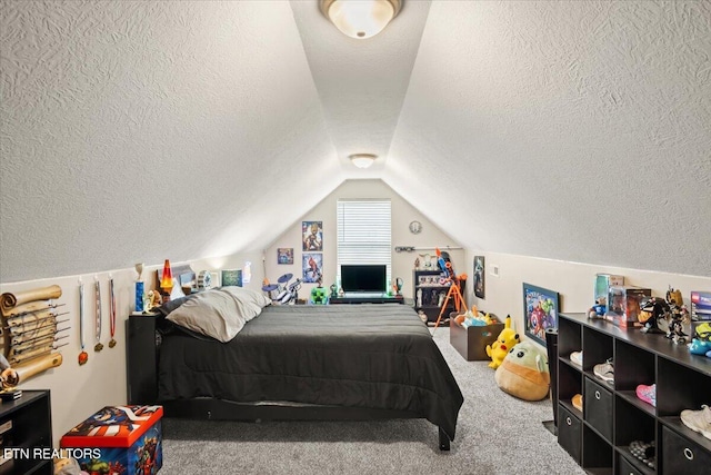 bedroom with lofted ceiling, carpet flooring, and a textured ceiling