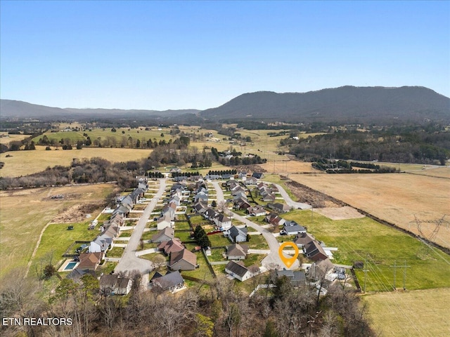 aerial view featuring a rural view and a mountain view