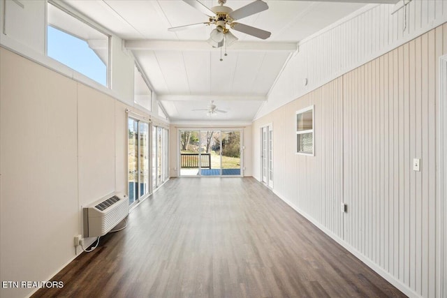 corridor with a wall mounted air conditioner, lofted ceiling with beams, and wood finished floors