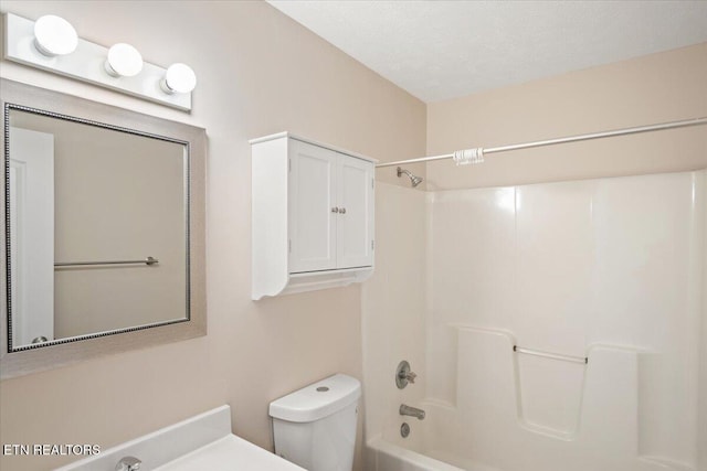 bathroom featuring toilet and bathtub / shower combination