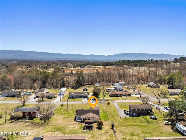 birds eye view of property featuring a mountain view