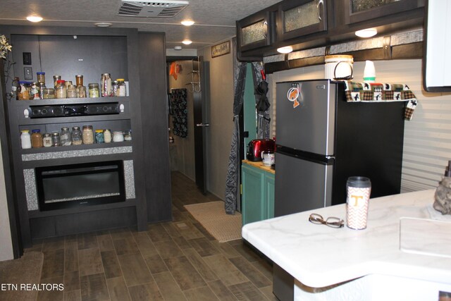 299 Harmony Way, Cosby, TN 37722 - kitchen featuring freestanding refrigerator, dark wood-style floors, glass insert cabinets, and light countertops