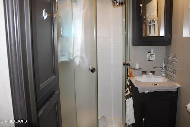 299 Harmony Way, Cosby, TN 37722 - full bathroom with a shower stall, vanity, and decorative backsplash