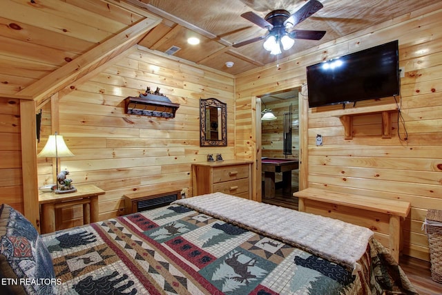 bedroom featuring wood ceiling, visible vents, and wood walls