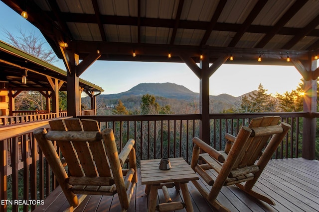 wooden terrace with a mountain view