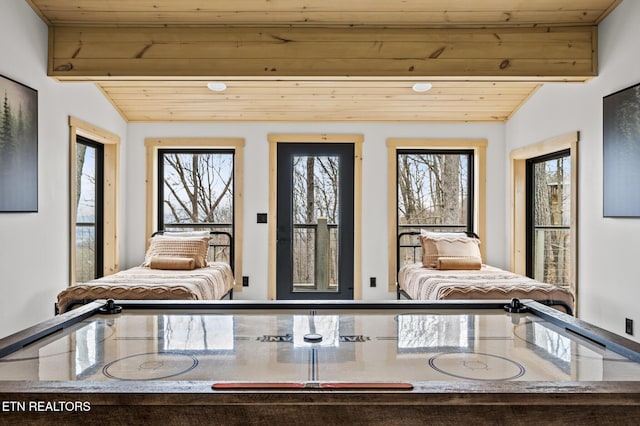 interior space featuring beam ceiling and wood ceiling