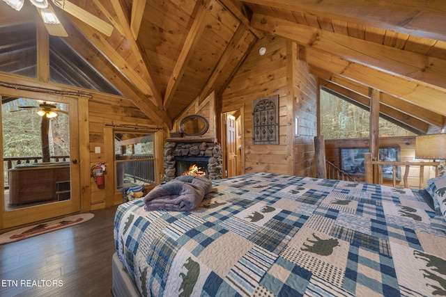 bedroom featuring wood finished floors, a stone fireplace, wood walls, wood ceiling, and vaulted ceiling with beams