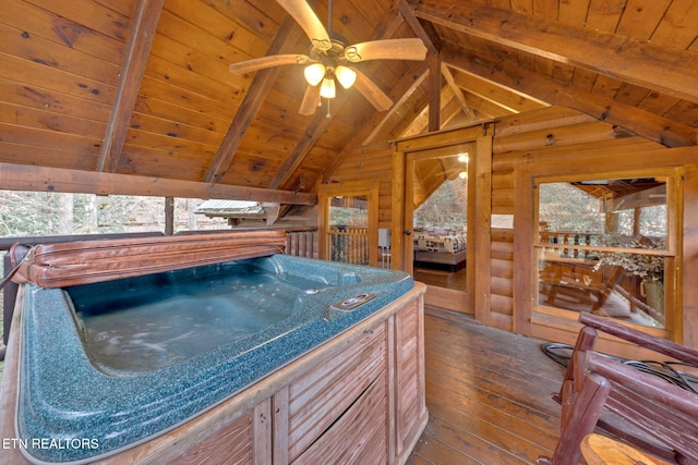 interior space with vaulted ceiling with beams, wood ceiling, and dark wood-type flooring